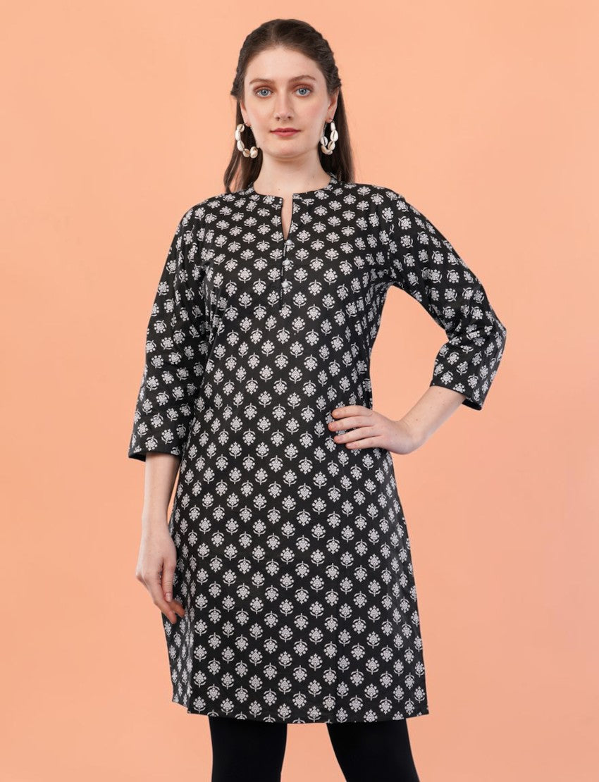 Model wearing an Eelika black and white floral print cotton kurti with 3/4 sleeves and a mandarin collar