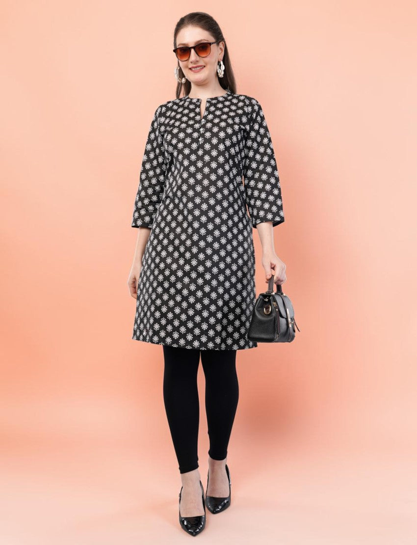 Eelika black and white floral print cotton kurti with mandarin collar and 3/4 sleeves worn by a model