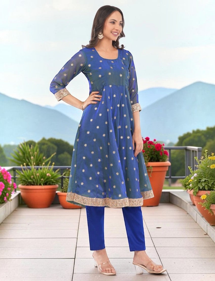 Eelika blue silk blend Anarkali kurta set with floral embroidery, 3/4 sleeves, and matching trousers on a model.