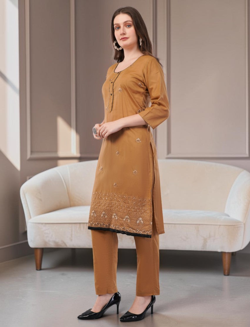 Eelika caramel brown cotton salwar suit set with 3/4 sleeves, intricate embroidery, and black border trim on trousers