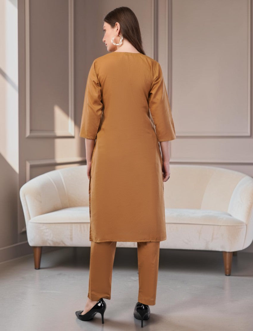 Eelika caramel brown cotton salwar suit set with 3/4 sleeves and matching trousers, back view on a model