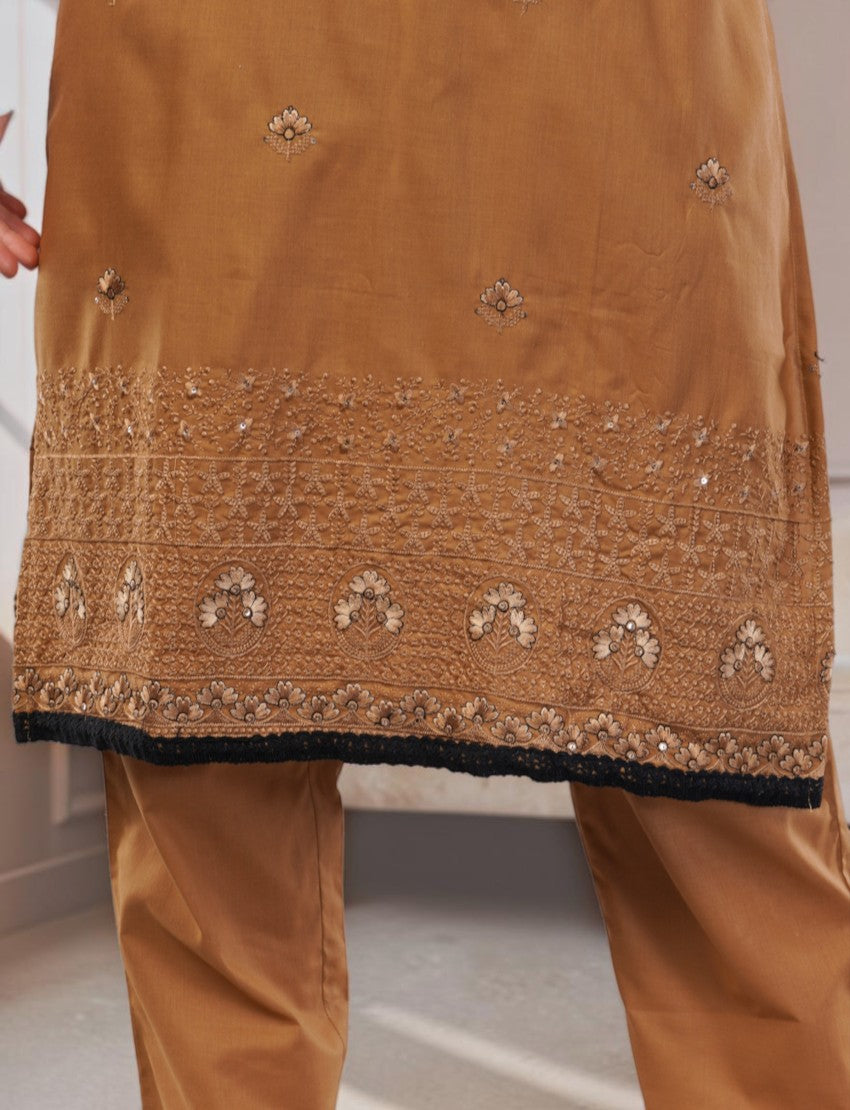 Eelika caramel brown cotton salwar suit featuring intricate floral embroidery and a contrasting black border trim