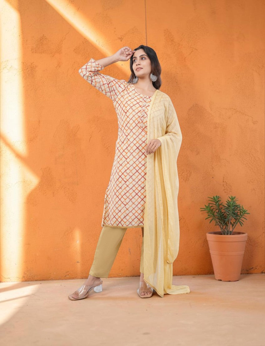 Eelika beige and orange checkered organza salwar suit with 3/4th sleeves, cotton trousers, and a matching dupatta.