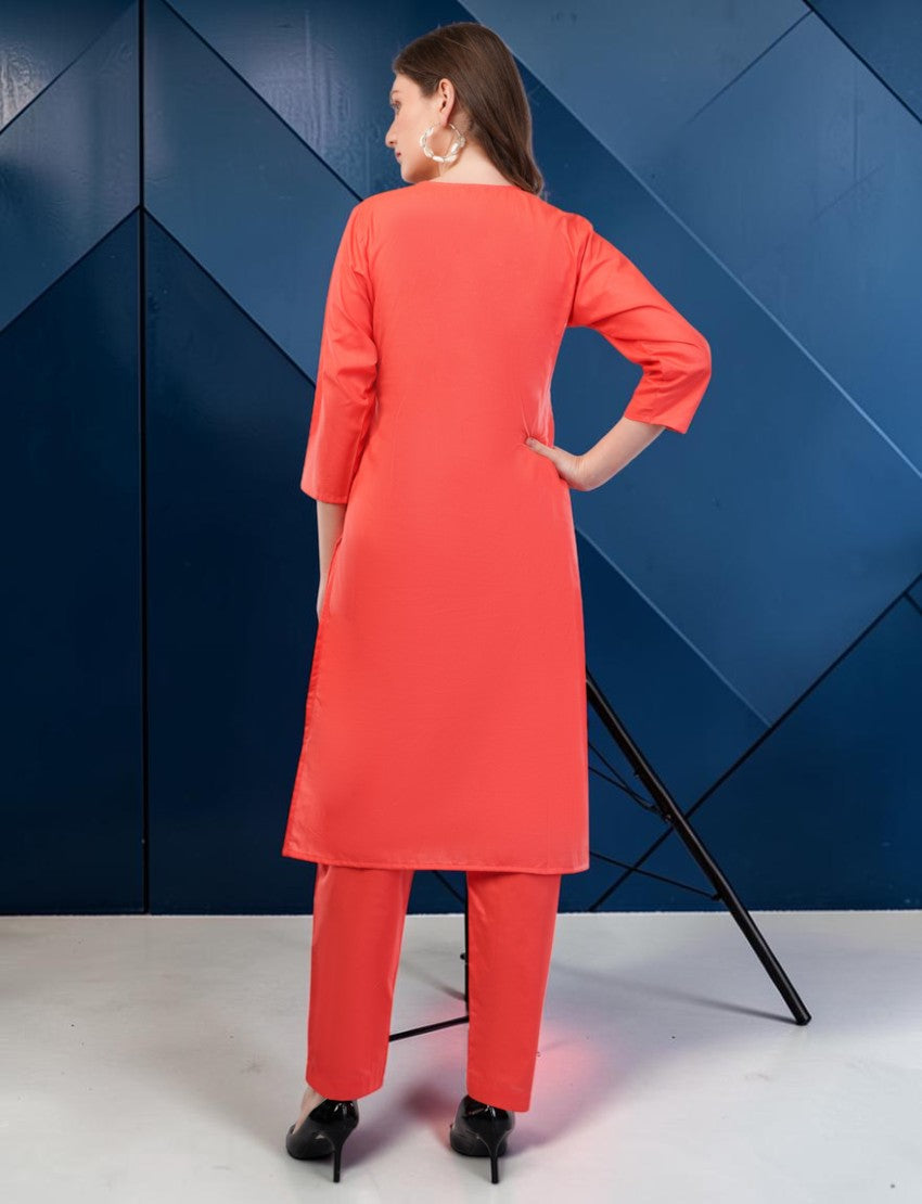 Eelika coral red cotton salwar suit set with 3/4 sleeves and trousers, back view on a model