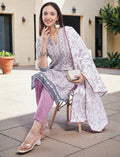 Eelika cotton kurta set featuring a printed V-neck calf-length top, mauve trousers, and a matching floral dupatta.