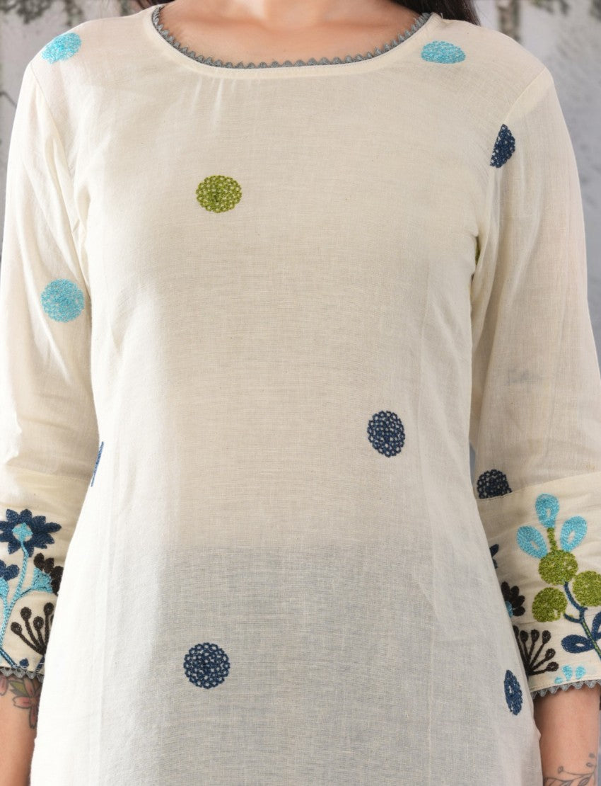 Eelika cotton salwar suit set featuring a cream calf-length top with blue and green floral embroidery and 3/4 sleeves