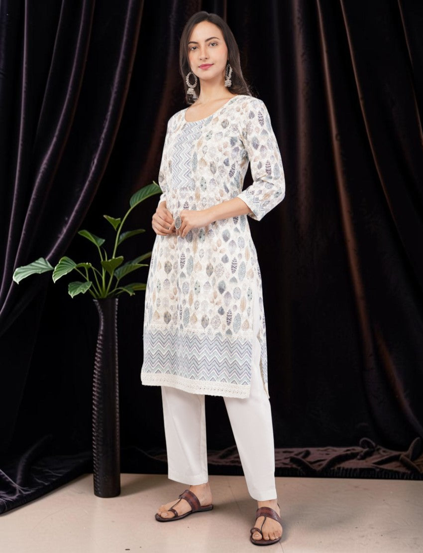 Eelika cotton salwar suit set featuring a leaf-printed knee-length kurta, white trousers, and a matching dupatta.