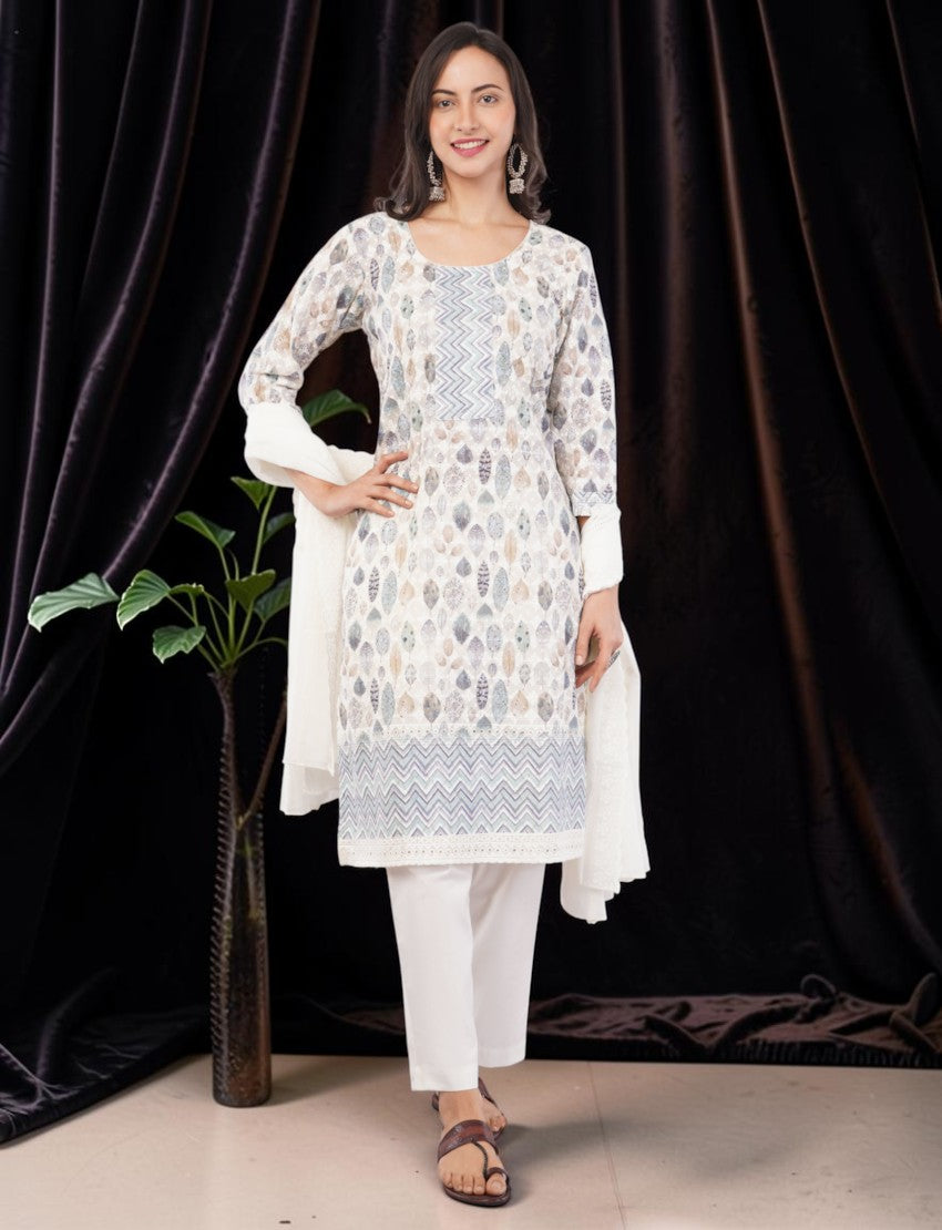Eelika cotton salwar suit set featuring a leaf print, embroidery, and a white dupatta worn by a smiling model.