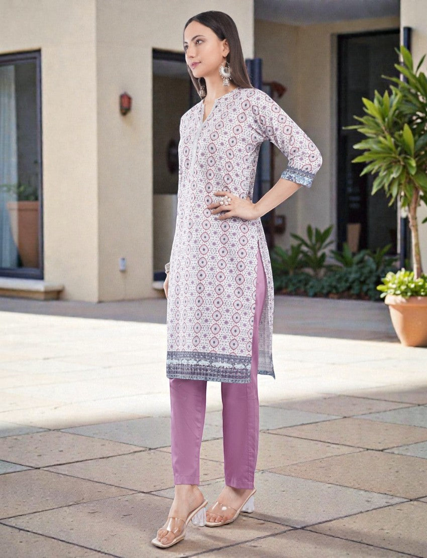 Eelika women's cotton printed kurta with V-neck, 3/4 sleeves, and matching trousers in a stylish ethnic suit set.