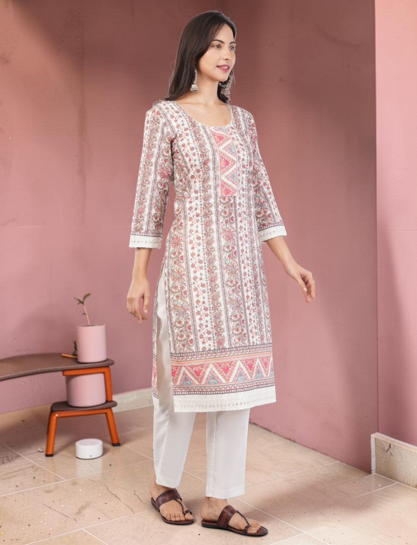 Eelika cotton salwar suit set with pink floral print, 3/4 sleeves, round neck, and white trousers in a studio setting