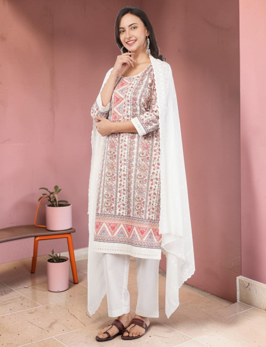 Eelika cotton salwar suit set with printed knee-length kurta, white trousers, and floral dupatta with 3/4 sleeves.