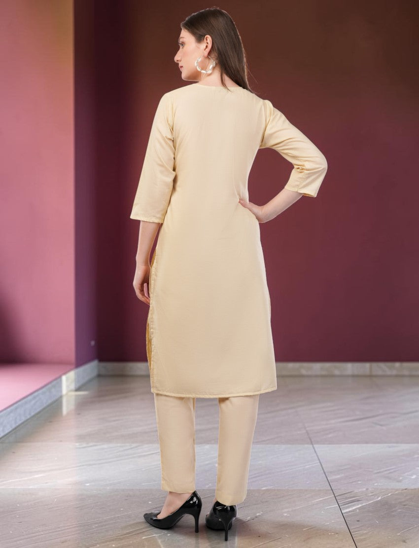 Eelika cream cotton salwar suit set featuring a knee-length kurta with 3/4 sleeves and matching trousers
