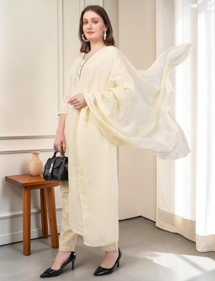 Eelika cream cotton salwar suit set with embroidered details, 3/4 sleeves, and matching dupatta worn by a model