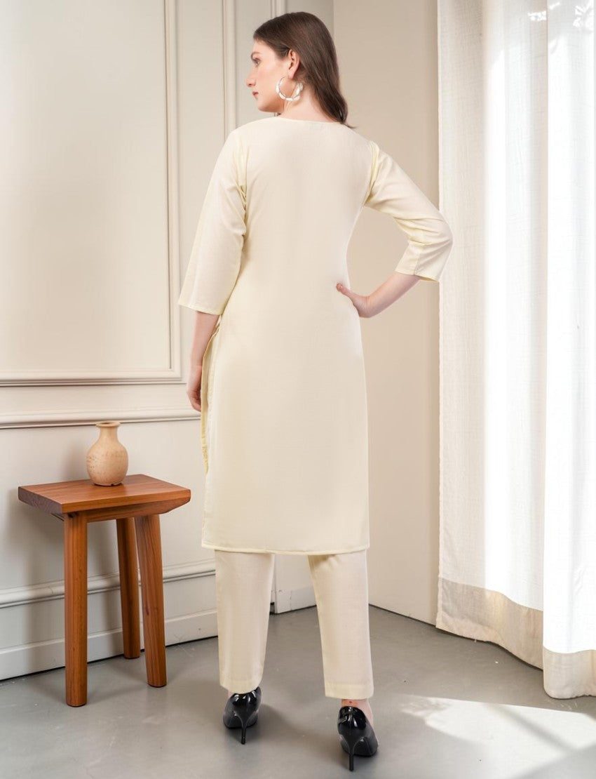 Eelika cream cotton salwar suit set with 3/4 sleeves and trousers, shown from the back on a model