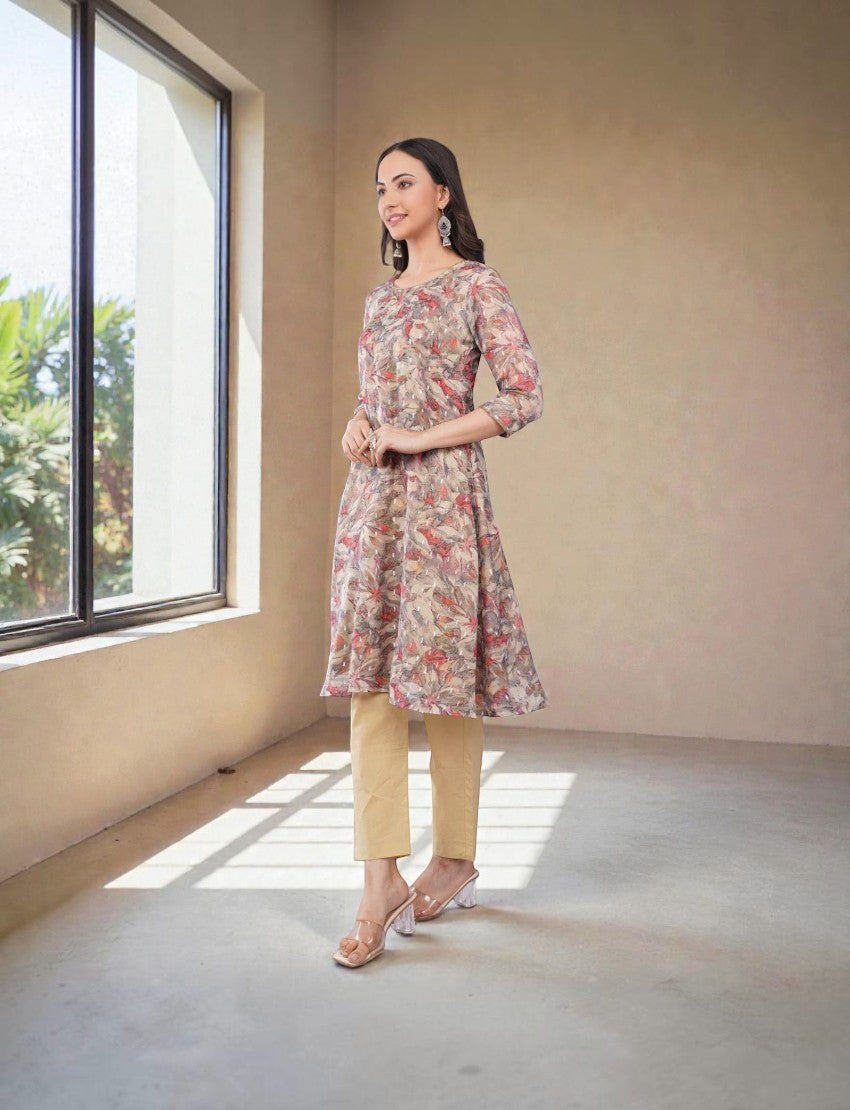 Model wearing an Eelika floral printed cotton Anarkali kurta with 3/4th sleeves, beige trousers, and a dupatta.