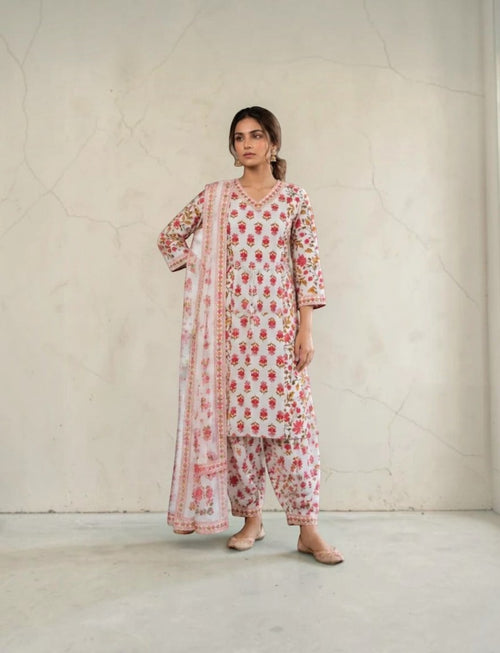 Eelika cotton salwar suit set featuring a V-neck floral print calf-length kurta, matching trousers, and a dupatta.