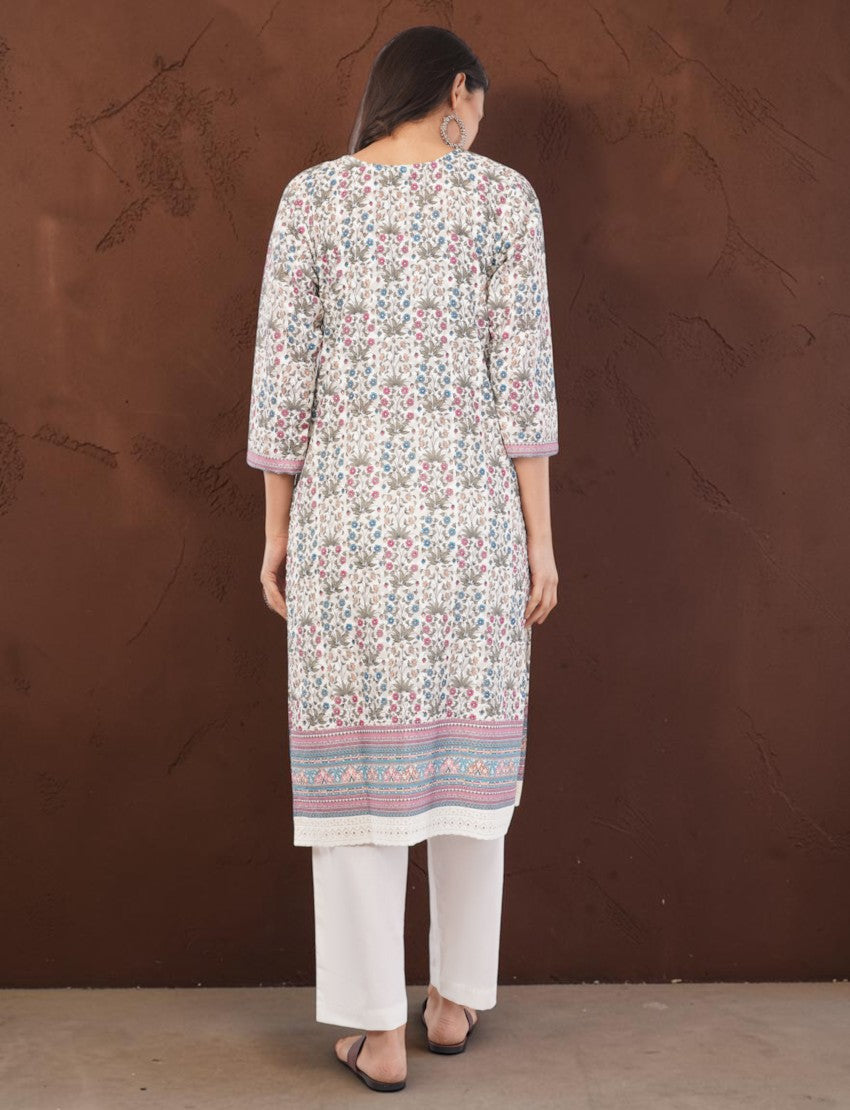 Back view of an Eelika cotton salwar suit featuring a floral print knee-length kurta with 3/4 sleeves and white trousers