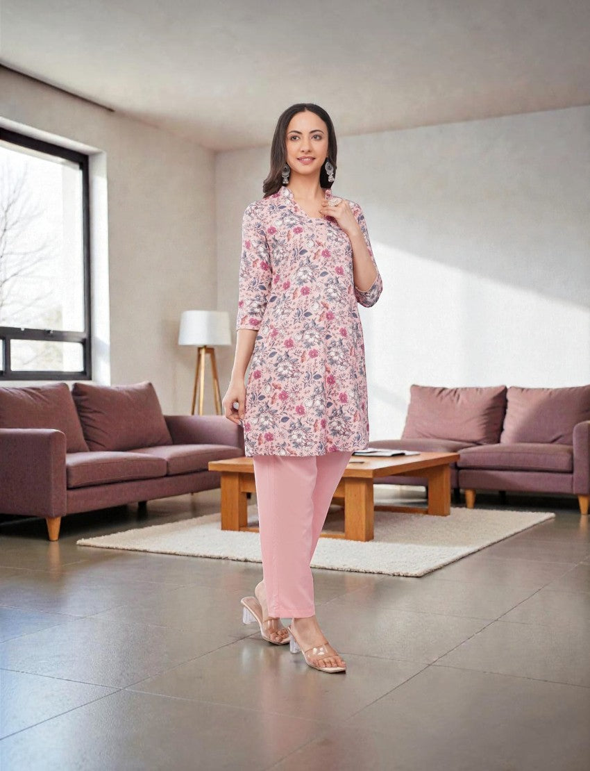 Eelika women's floral print cotton blend kurta with solid pink palazzo pants, featuring 3/4 sleeves and V-neck.