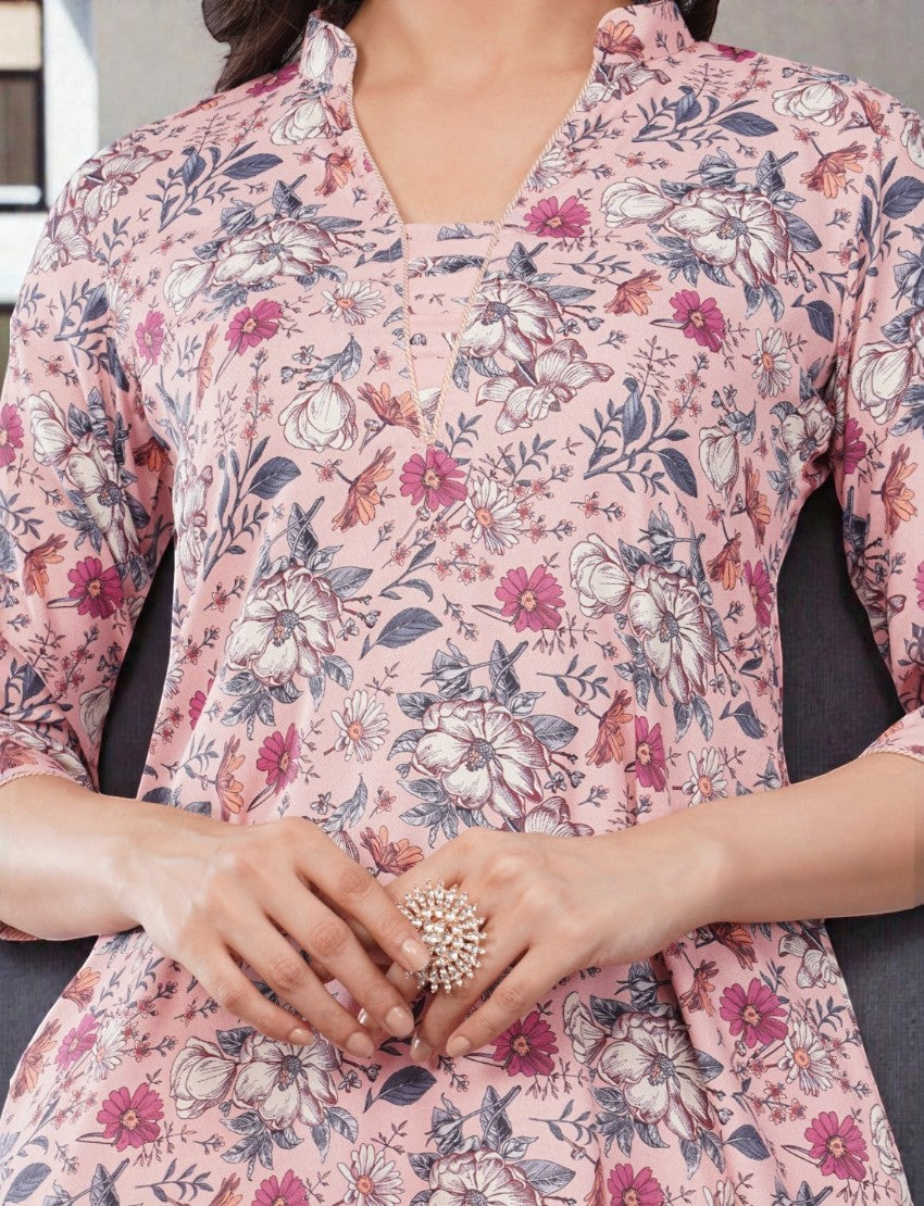 Eelika women's calf-length cotton blend kurta featuring a pink floral print, V-neck, and 3/4th sleeves.