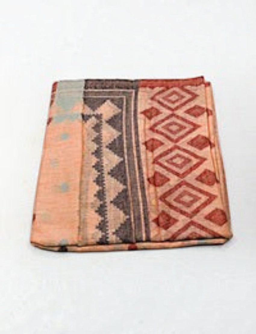 Eelika cotton stole in peach and grey with geometric diamond and zigzag patterns folded on a white background