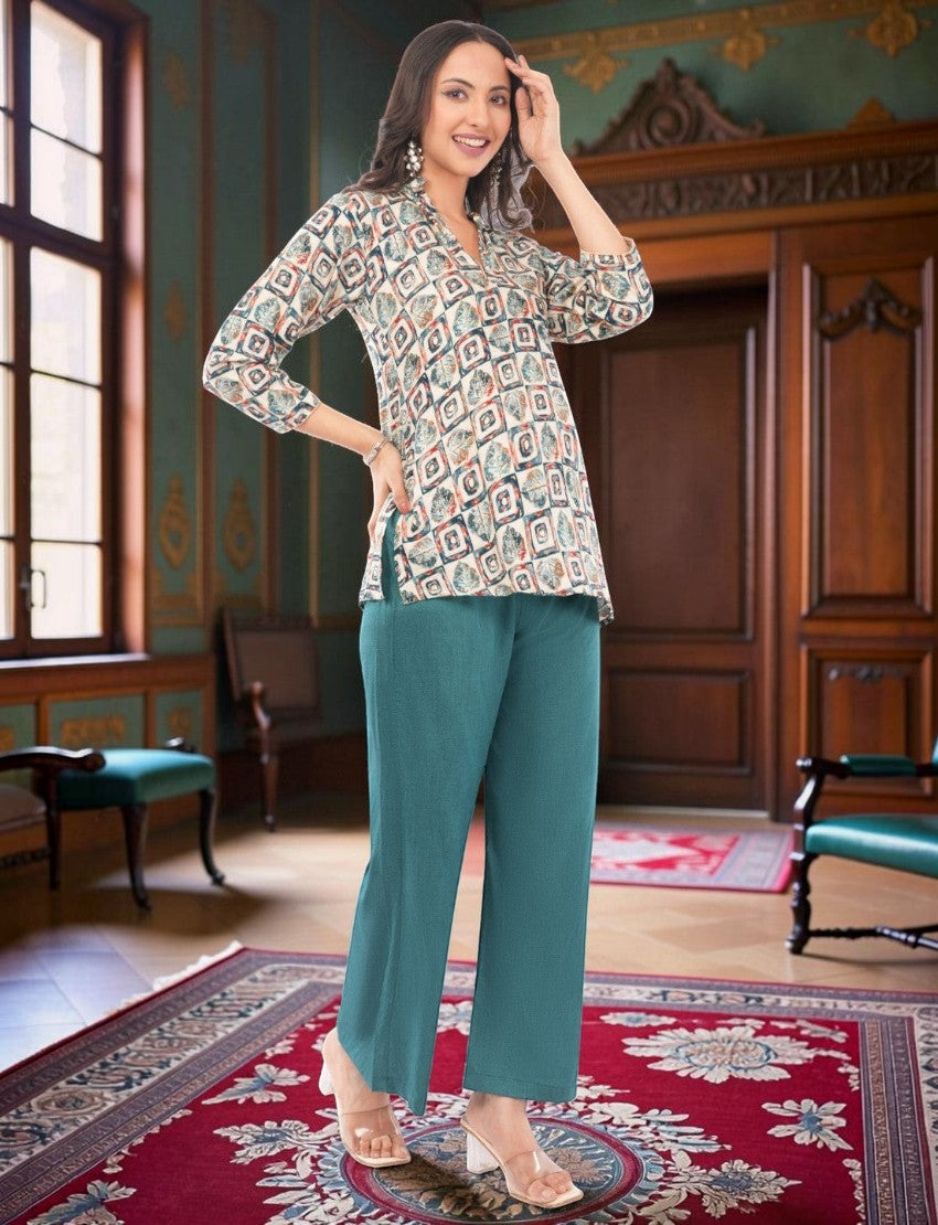 Eelika women's multicolor geometric print crepe kurta with teal trousers and dupatta in a classic interior setting
