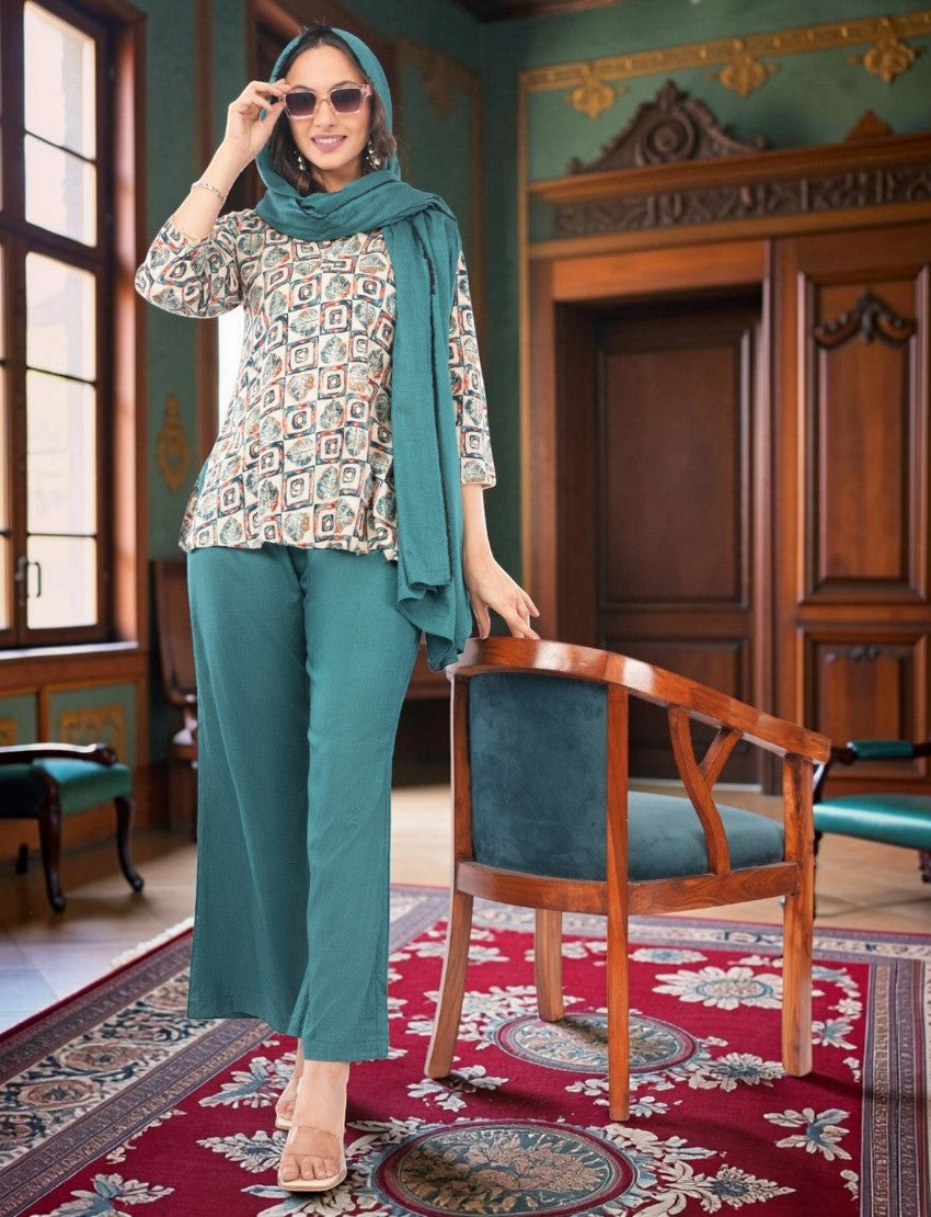 Eelika women's multicolor geometric print crepe kurta with teal trousers and matching dupatta in a classic room.