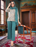Eelika women's multicolor geometric print crepe kurta with teal trousers and matching dupatta in a classic room.