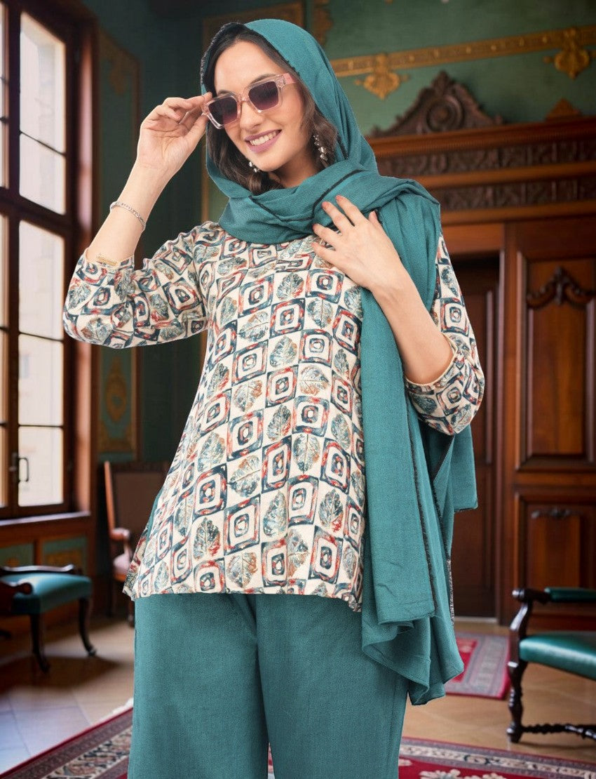 Eelika multicolor geometric print crepe top with teal trousers and matching dupatta worn by a smiling woman