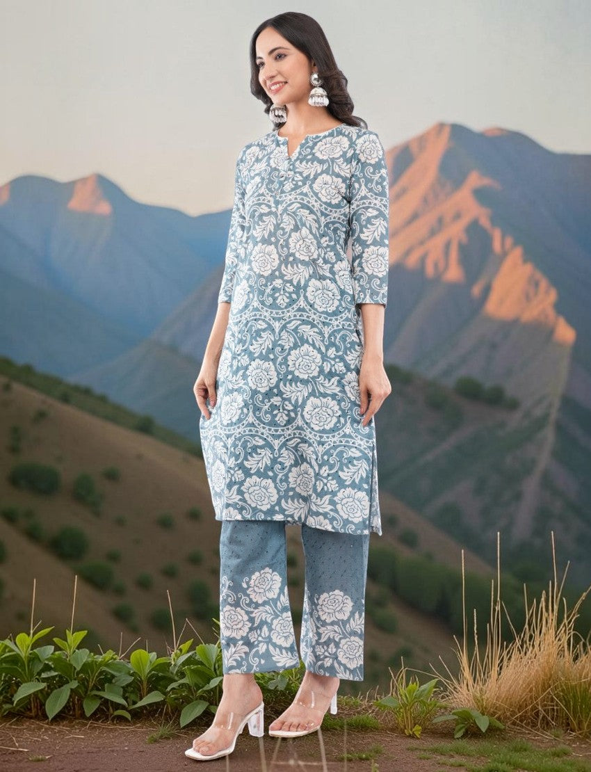 Model wearing an Eelika grey cotton chikankari salwar suit with floral embroidery, V-neck, and 3/4th sleeves.