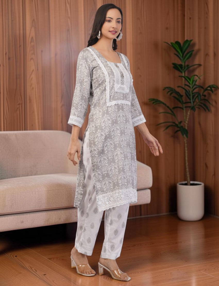 Eelika grey and white printed cotton salwar suit set with square neck, 3/4th sleeves, and delicate lace detailing.