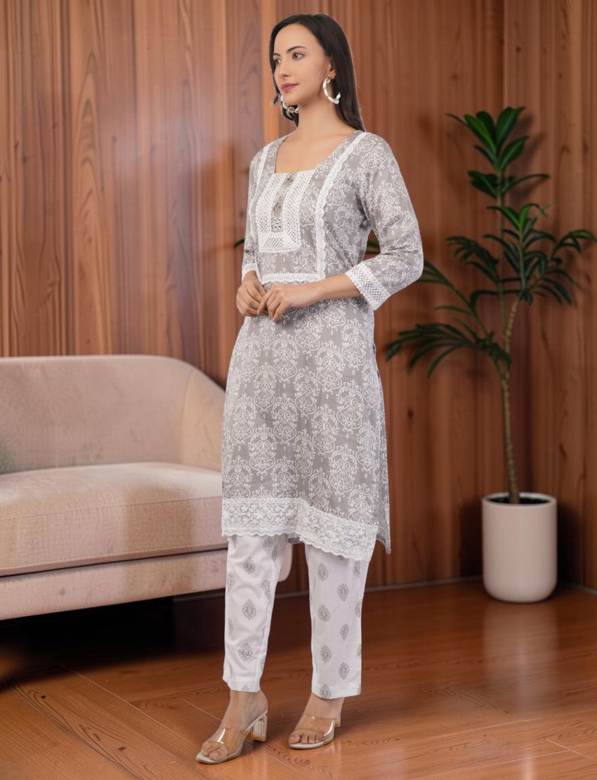 Eelika grey and white printed cotton salwar suit set with square neck, 3/4 sleeves, and delicate lace embroidery.
