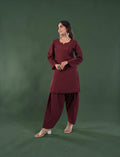 Eelika maroon silk blend Farshi suit set with a V-neck kurta and 3/4th sleeves worn by a model