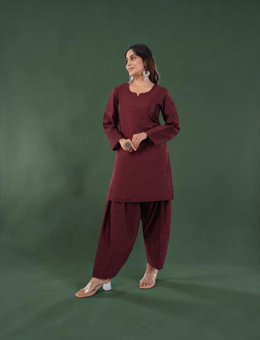 Eelika maroon silk blend Farshi suit set with a V-neck kurta and 3/4th sleeves worn by a model