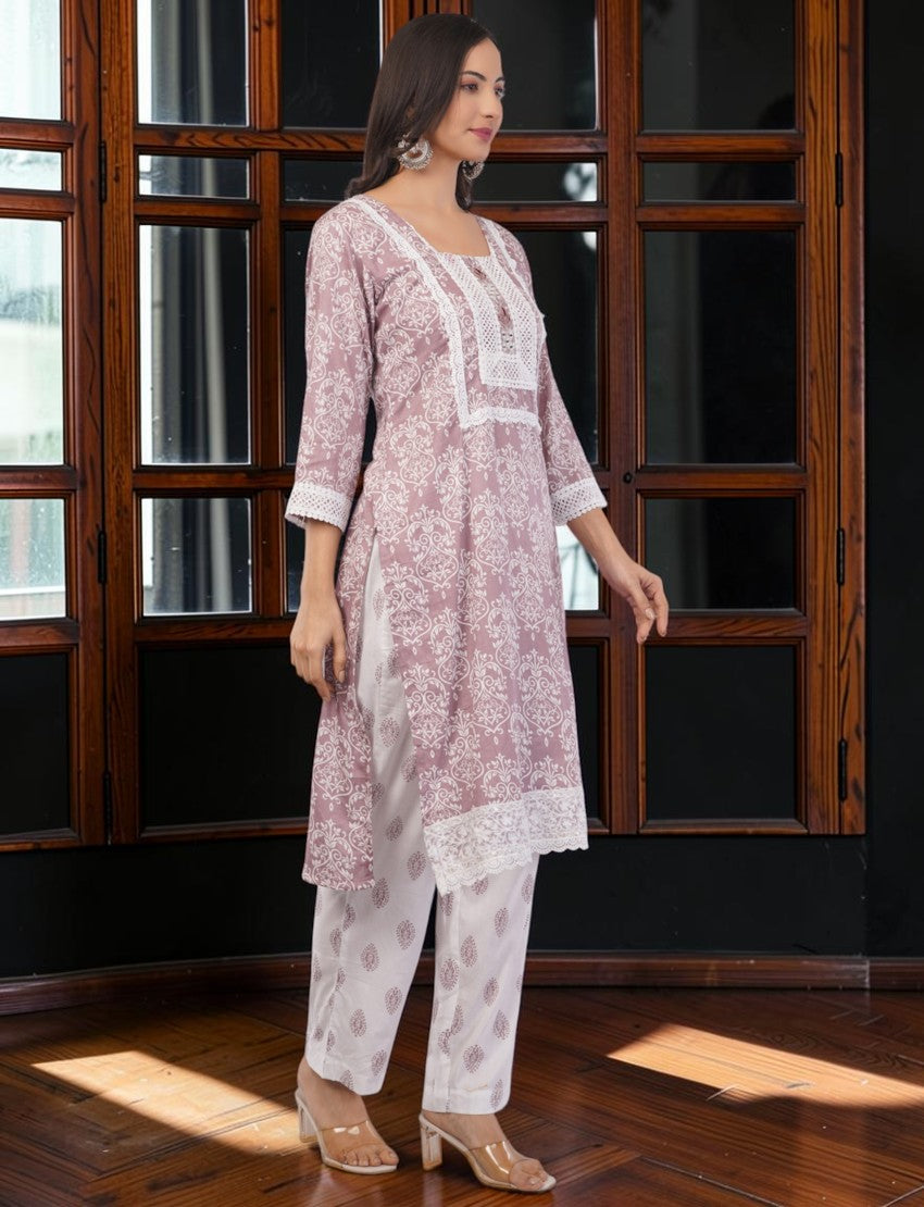 Eelika mauve pink cotton salwar suit set with white lace trim, printed knee-length top, and matching trousers