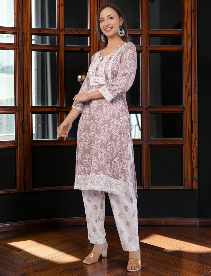 Eelika mauve pink cotton salwar suit set with white floral print, square neck, 3/4 sleeves, and lace detailing.