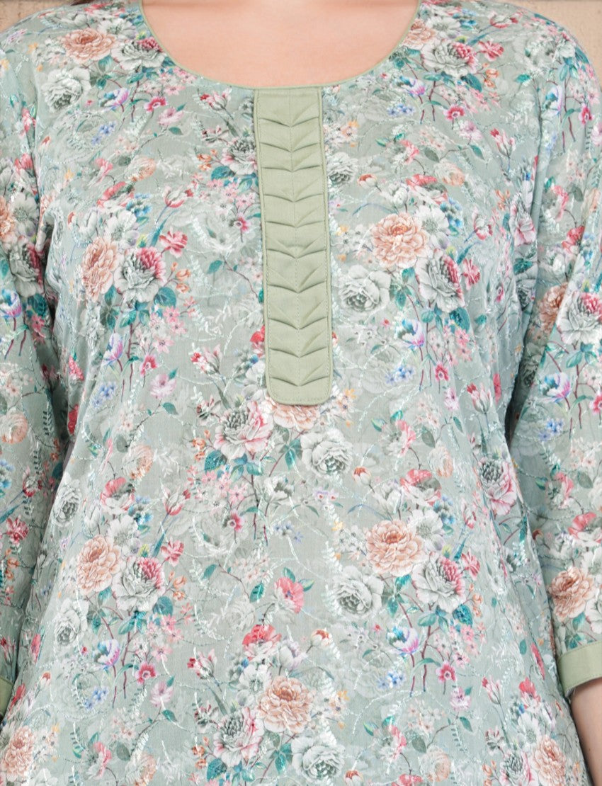Eelika mint green cotton kurta featuring a delicate floral print, round neck, and decorative pleated placket detail.