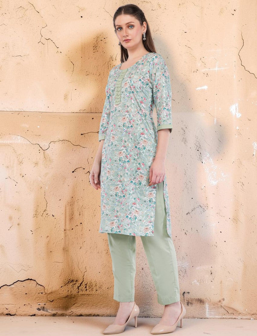 Eelika mint green floral cotton salwar suit set with embroidered calf-length kurta, trousers, and 3/4th sleeves.