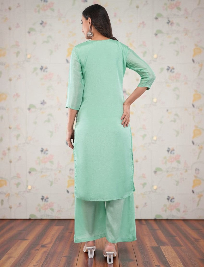 Back view of Eelika mint green silk crepe salwar suit set with 3/4th sleeves and matching trousers