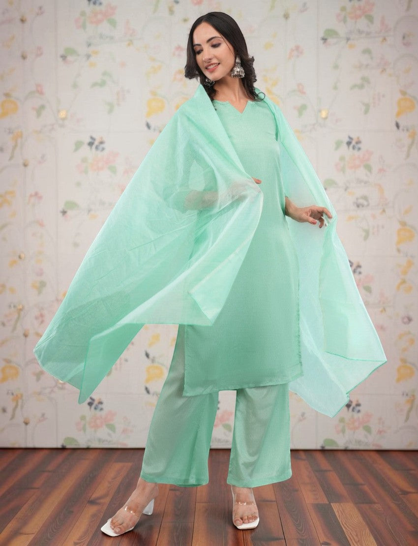 Eelika mint green silk crepe salwar suit set with V-neck calf-length kurta, trousers, and matching sheer dupatta.