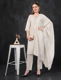 Eelika off-white cotton salwar suit set with 3/4 sleeves, embroidery, and matching dupatta on a model