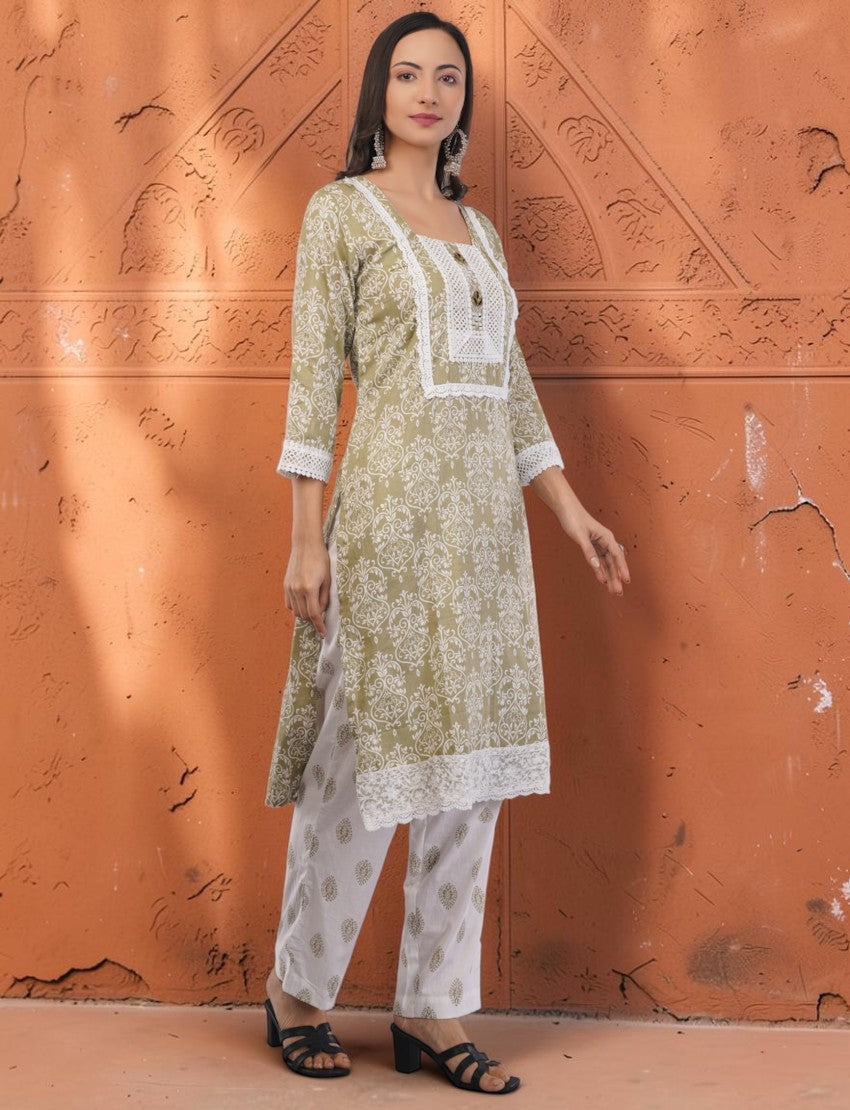 Eelika olive green printed cotton salwar suit with white lace embroidery, square neck, and matching trousers