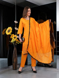 Eelika orange cotton salwar suit with 3/4 sleeves, embroidery, and matching dupatta worn by a model