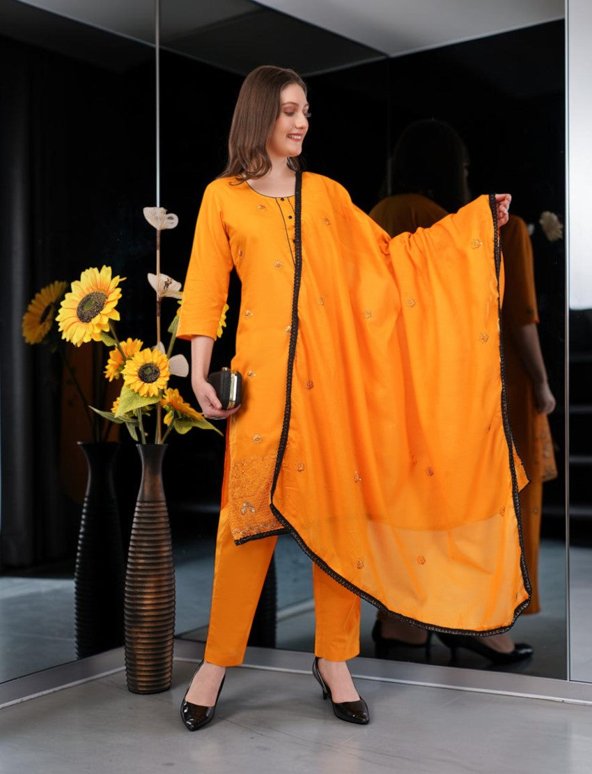 Eelika orange cotton salwar suit with 3/4 sleeves, embroidery, and matching dupatta worn by a model