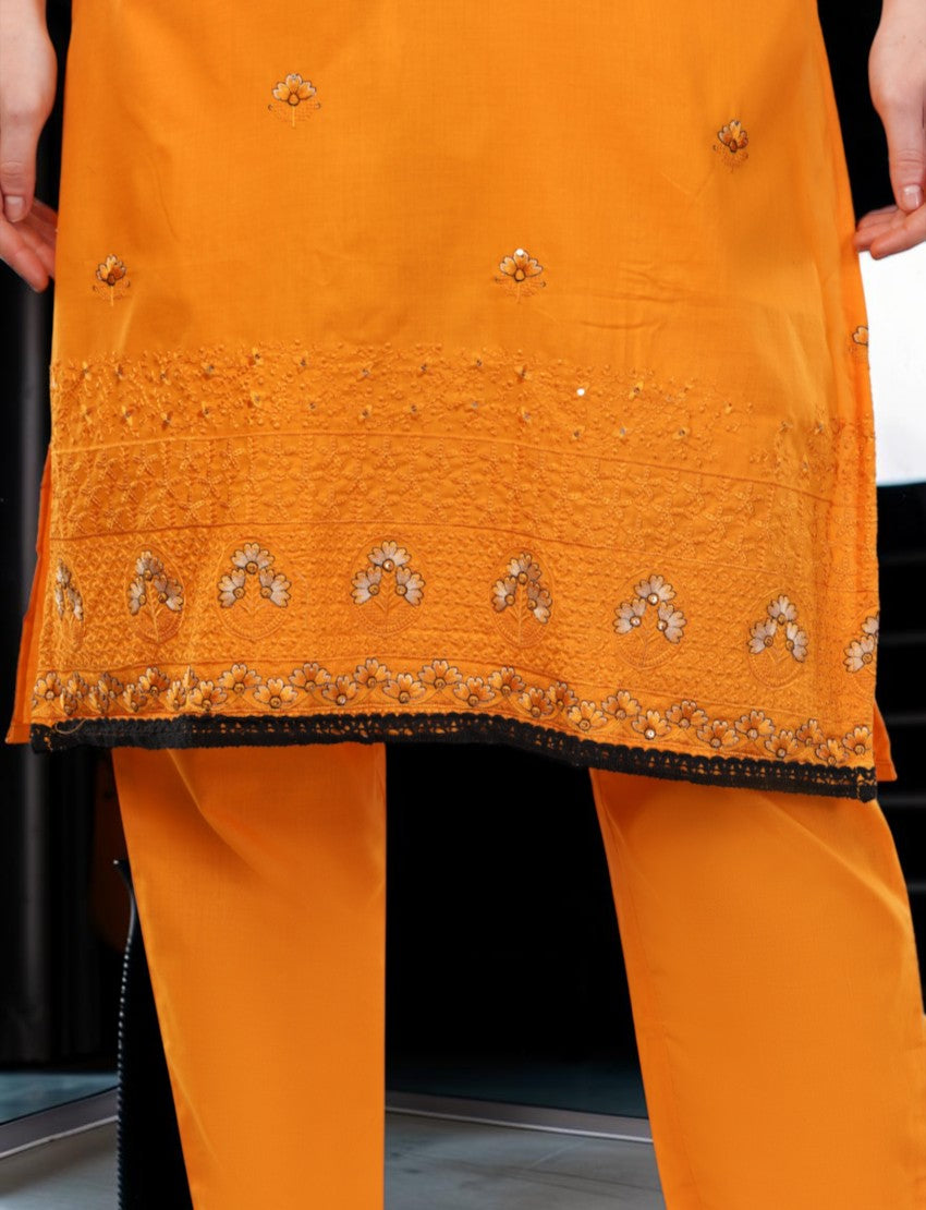 Eelika orange cotton salwar suit with intricate embroidery and matching trousers