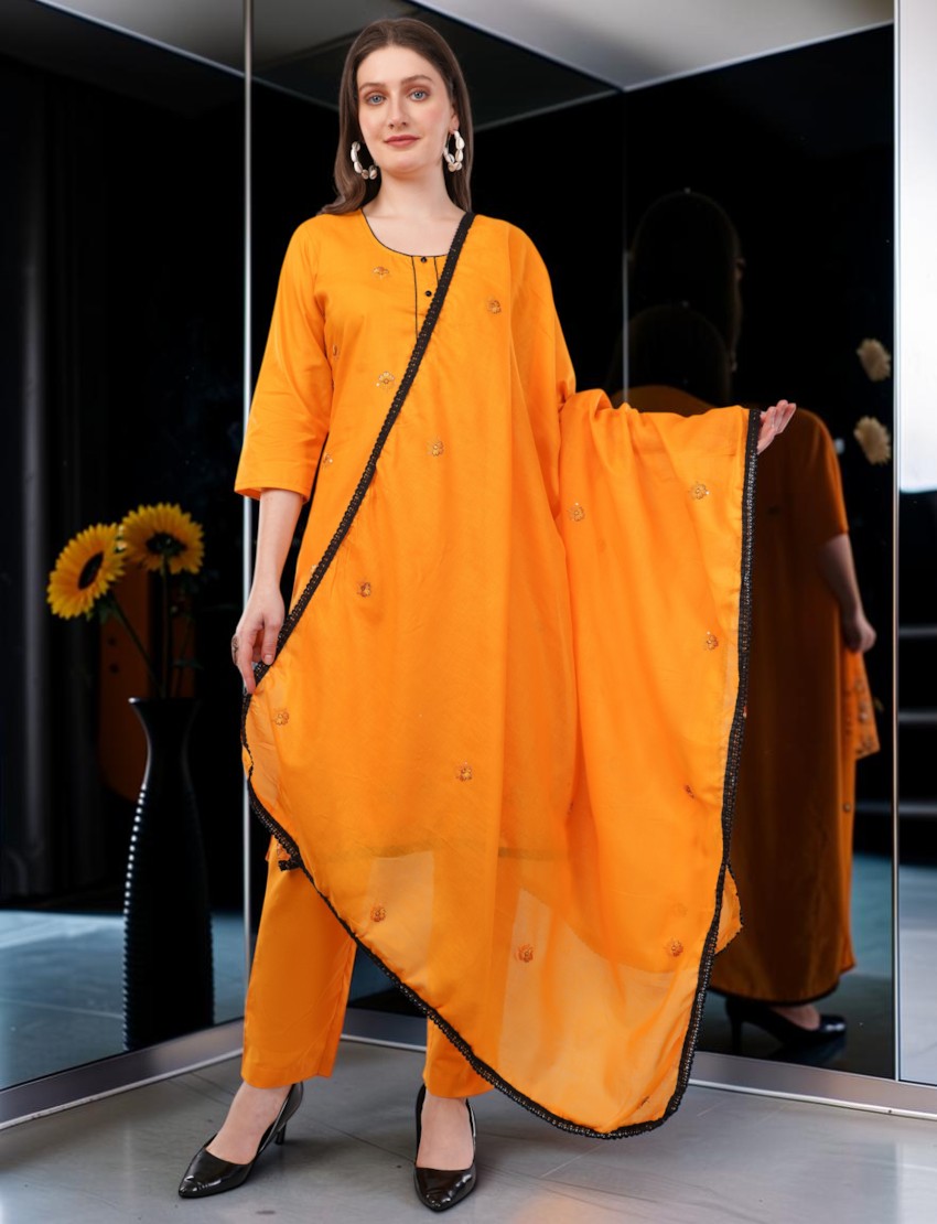 Eelika orange cotton salwar suit with 3/4 sleeves, embroidery, and matching dupatta, worn by a model.