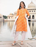 Eelika orange cotton salwar suit set with floral paisley print, V-neck, 3/4 sleeves, and patterned trousers.