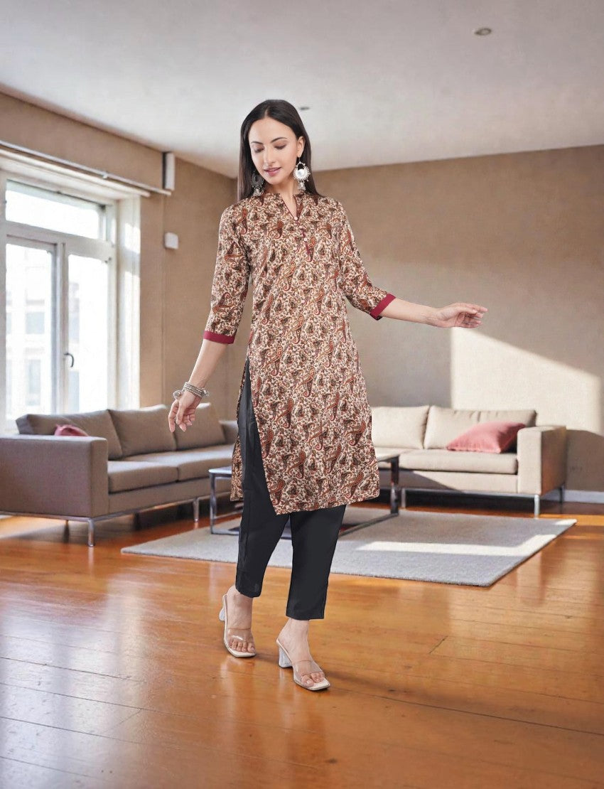 Eelika women's paisley print crepe salwar suit with mandarin neck, 3/4th sleeves, and black cotton trousers.
