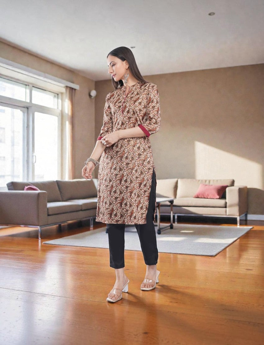 Eelika women's paisley print crepe salwar suit with mandarin collar, 3/4 sleeves, and black cotton trousers.