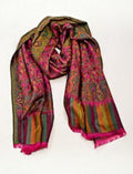 Eelika pashmina silk stole featuring a vibrant pink and green paisley floral pattern with striped fringe borders.
