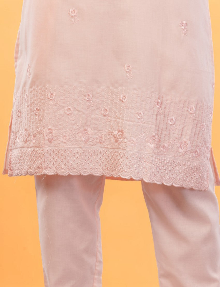 Eelika peach cotton salwar suit featuring delicate floral embroidery and a scalloped hemline on the knee-length top.
